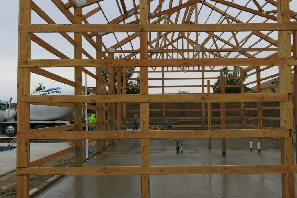 One of our sub-contractors pouring concrete at a recent shop build